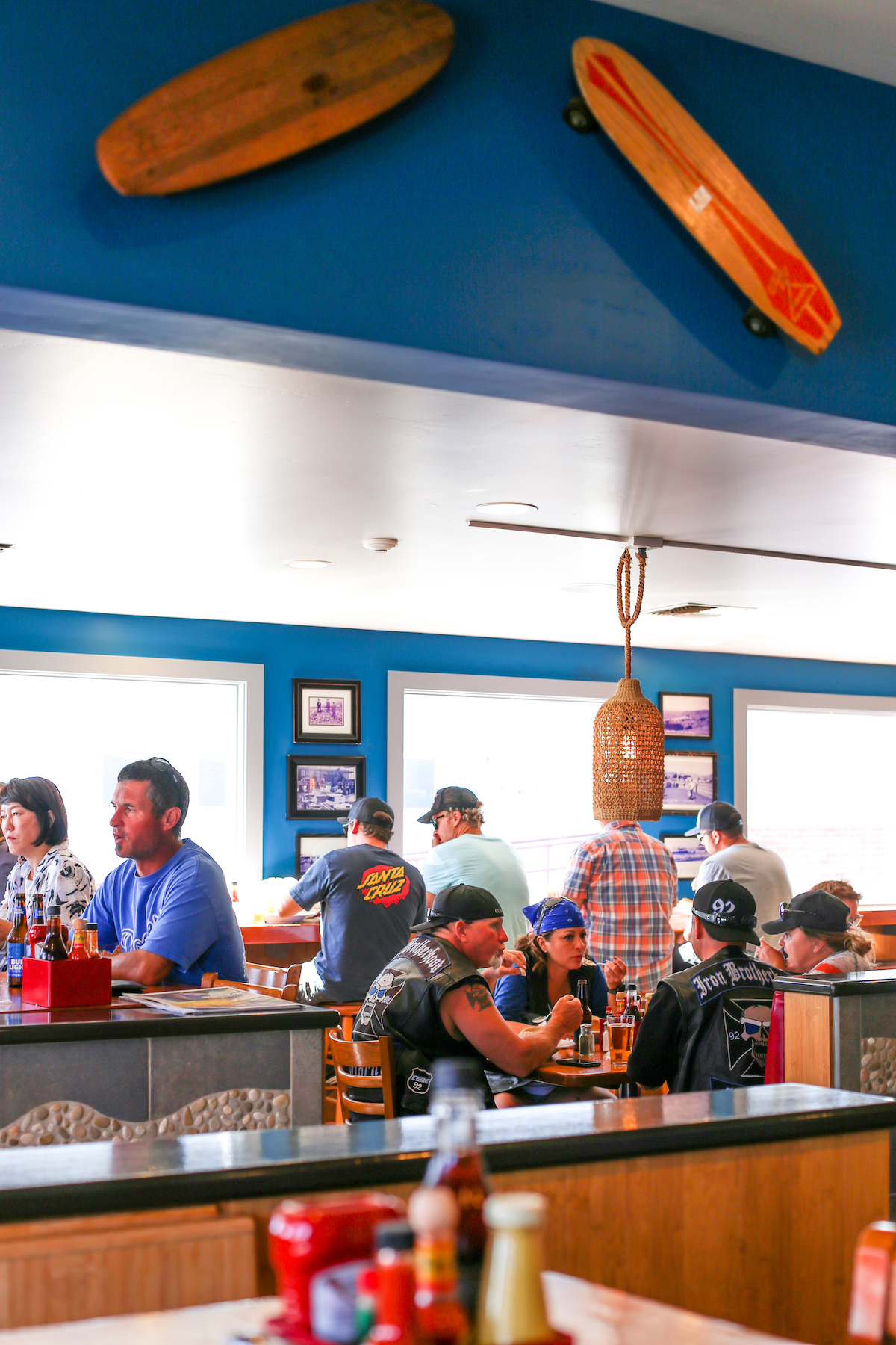 Interior of Duckie's Chowder House in Cayucos with diners eating at tables and on barstools