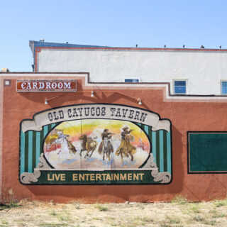 Mural of the Four Horseman on the side of the Old Cayucos Tavern and Card Room